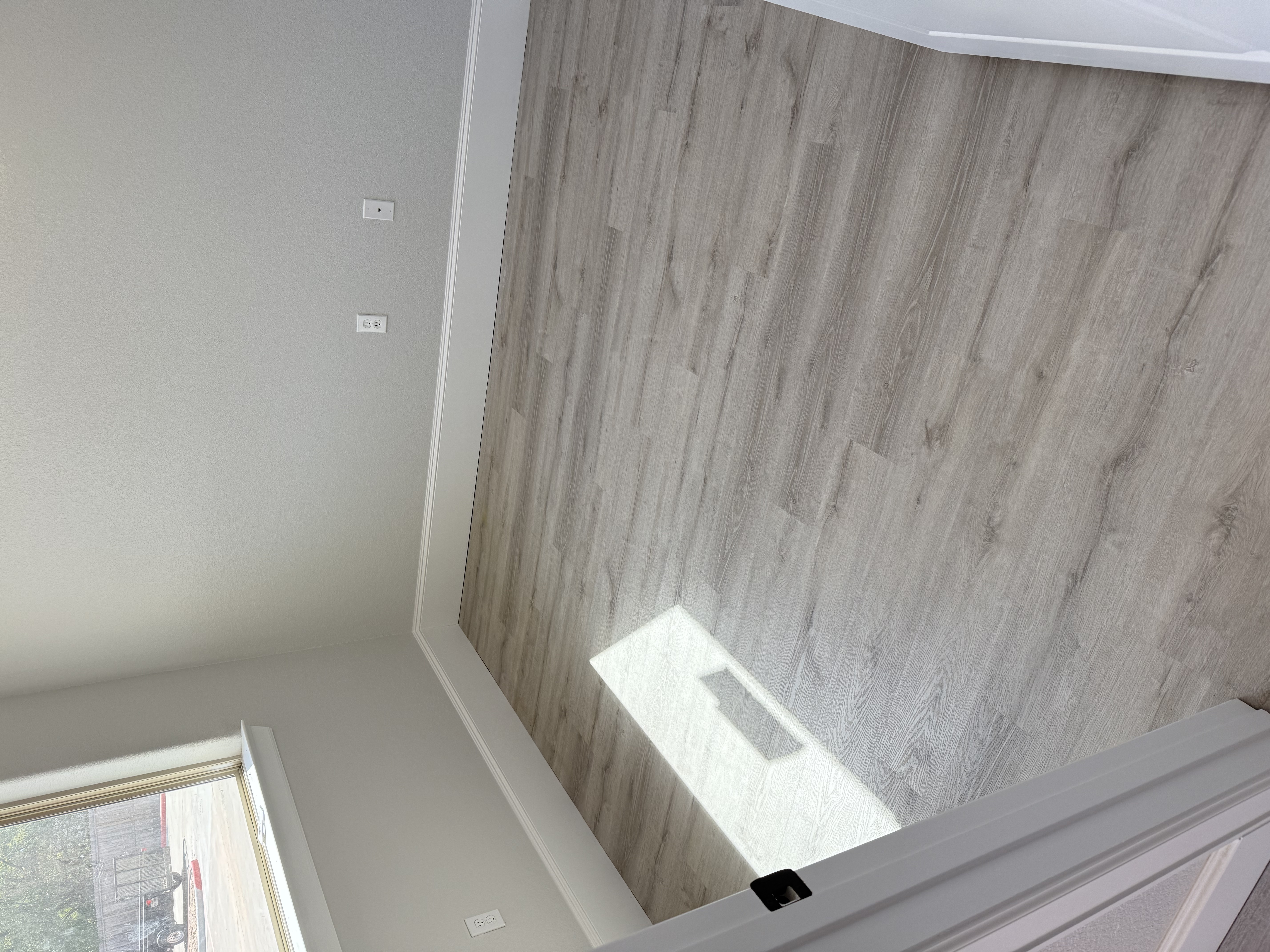 Finished vinyl flooring installation in a Houston room by J&L Luxury Flooring Houston