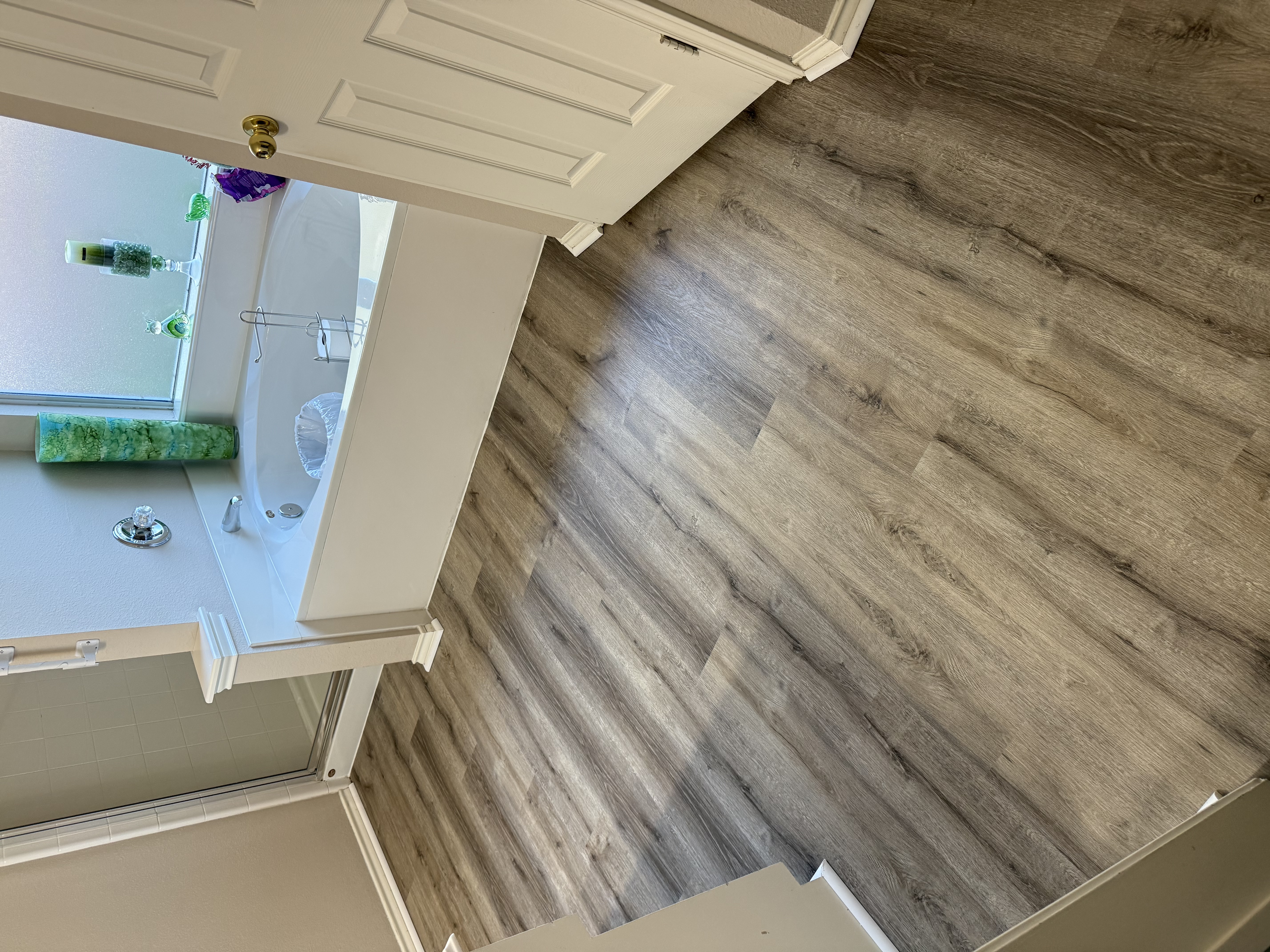 Vinyl flooring installation near me in a Houston bathroom by J&L Luxury Flooring Houston